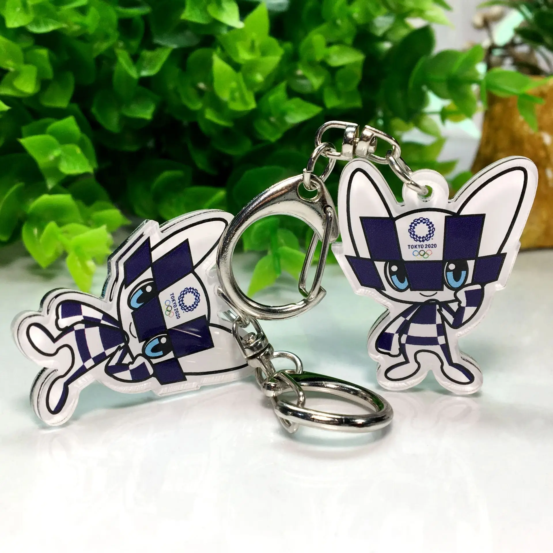 

Anime Keychain 2020 Japan Tokyo Olympics Souvenir Blue Miraitowa Red Someity Acrylic Keychain Cute Souvenir Pendant