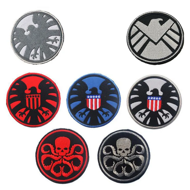 Значок девять змеиных родов Отдел отпуска и логотип агента подписанный двойной