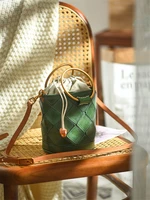 Niche design metal bracelet drawstring womens genuine leather bucket bag woven mini casual fashion shoulder messenger bag