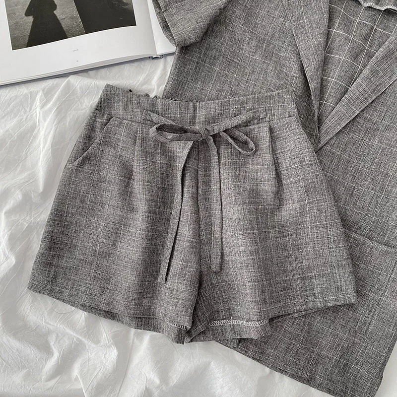 

fashion two-piece suit 2021 spring new women's loose short-sleeved shirt lace-up shorts suit lapel trend simple comfortable