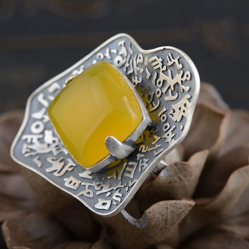 Кольцо женское из серебра 990 пробы регулируемый размер с желтым халцедоном |