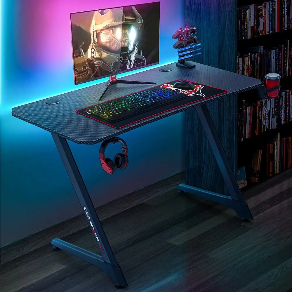 

Douxlife Computer Gaming Desk Ergonomic Design Z Shaped PC Table Gamer Workstation with Gaming Accessories for Home Office