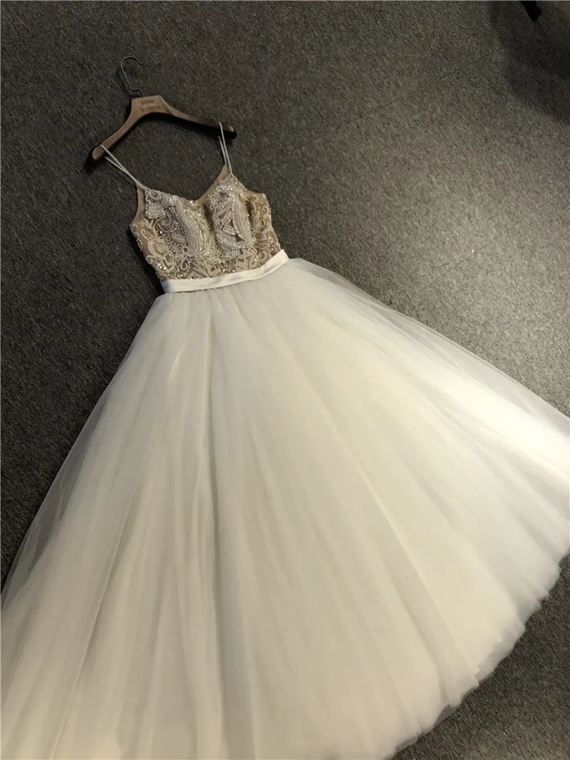 

Real Pictures Newest High Quality Customized Ivory Tulle V-neck Sleeveless Heavy Beadings A-line Floor Length Wedding Dresses