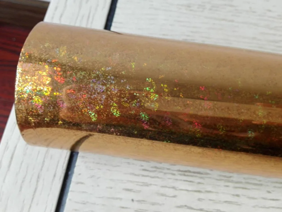 

Hot stamping foil holographic foil gold color hot press on paper or plastic heat transfer film