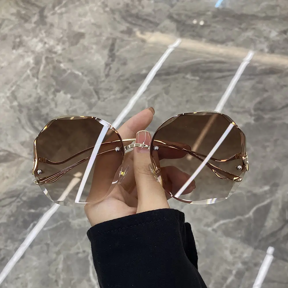 

2021 new rimless temperament round frame sunglasses for women