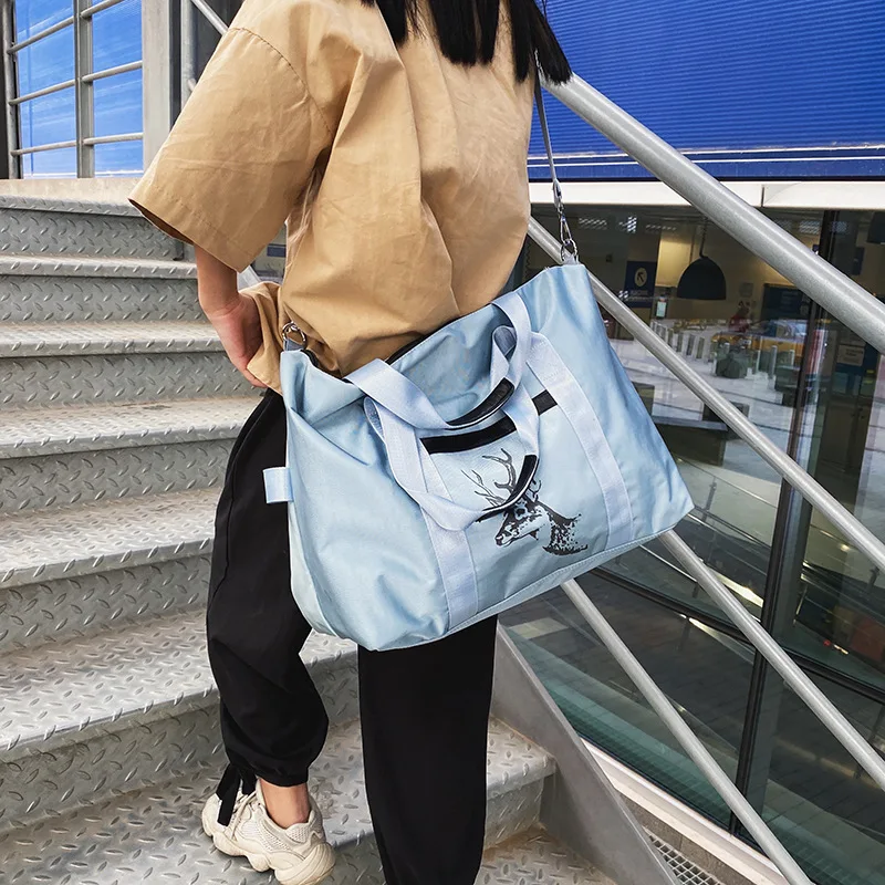 

2021 New Large Capacity Travel Bags Unisex Fitness Handbags Carry On Boarding Bag Nylon Storage Bags Sports Gym Hand Bag XA258M