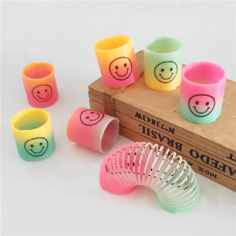 

Plastic Spring Coil Magic Toys Elastic Ring Folding Plastic Cartoon Magic Rainbow Circle Children Toy Magic Tricks