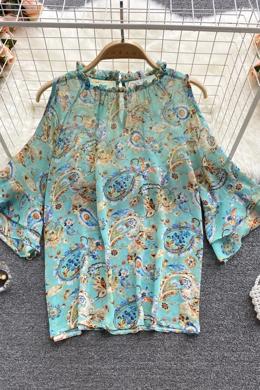 

Lightweight chiffon blouse women's summer dress 2021 new sweet wood ear collar scheming hollow trumpet sleeve printed shirt
