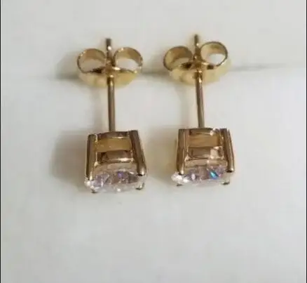 

Custom order of 10k yellow gold 6.5mm 1.0ct each round cut moissanite earrings