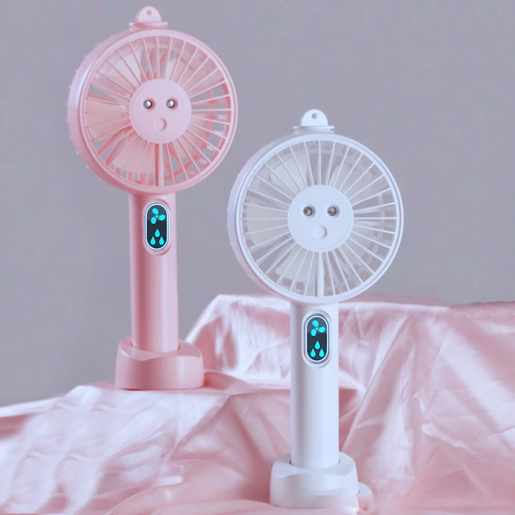 

Battery Operated Practical Double Nozzle Low Noise Desktop Outdoor Travel Multifunctional Cooling Handheld Fan With Phone Holder