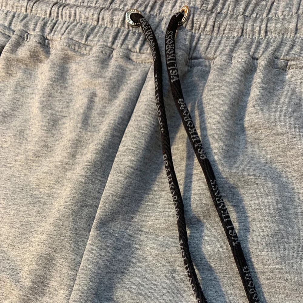 Спортивные штаны Великоросс цвета серый меланж жаккардовые лампасы и брендовые