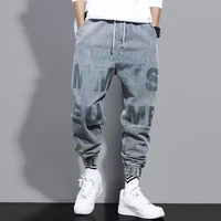 letter printed jeans mens loose cropped pants locomotive japanese fashion streetwear harem harajuku ankle banded casual pants