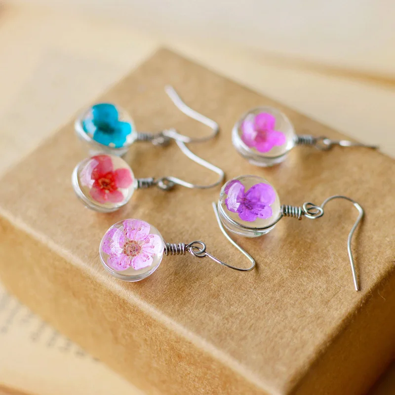 

Simple and generous stainless steel natural dandelion daffodil dried flower spherical earrings