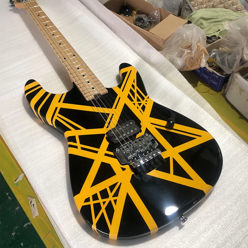 

High quality electric guitar, yellow stripes, black paint, maple neck, bright fingerboard, double shake, shipping included