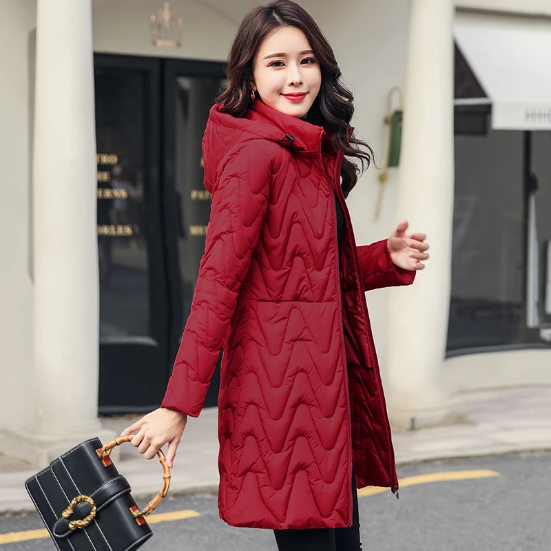 

Solid collar hooded winter women with fur ball long autumn cotton-padded womens waistcoat large yards colete 2020 fashion coat