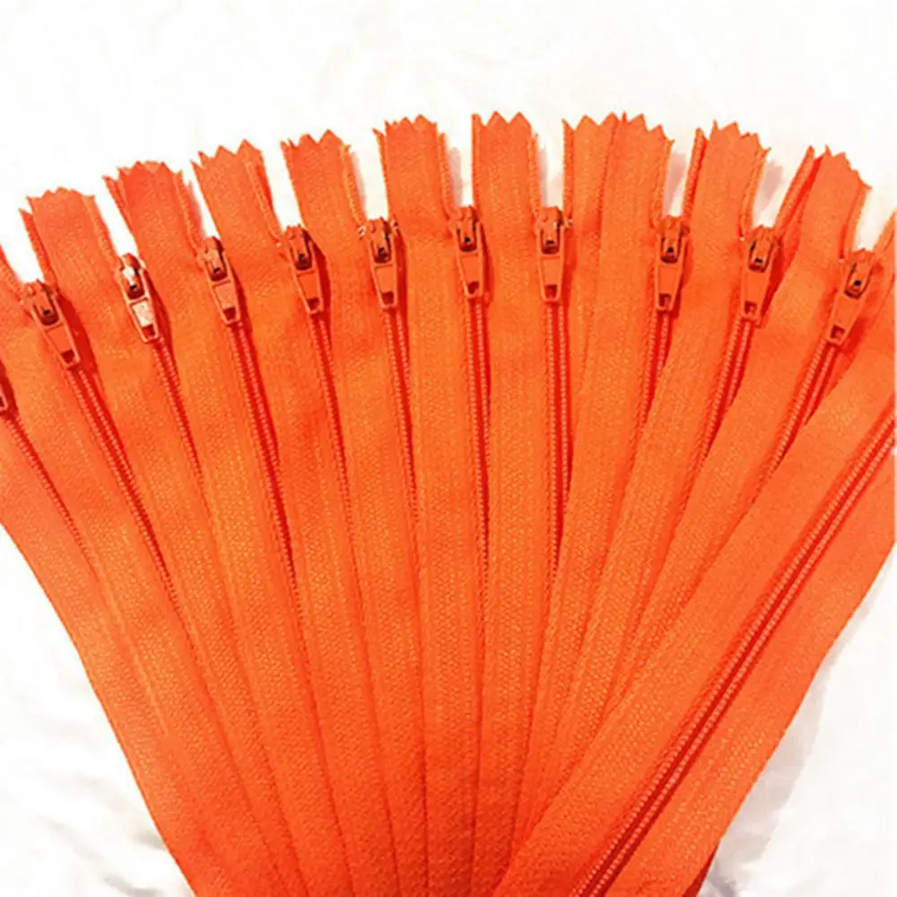 

10 pieces. 55cm (22inch) Orange nylon coil, zipper, tailor, crafter and fgdqrs