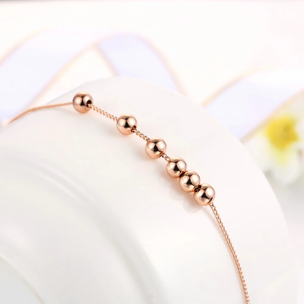 Женский браслет с маленькими шариками цепочкой из звеньев под розовое золото