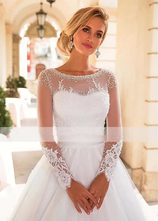 

Amazing Beaded See Through Long Sleeve Wedding Gowns Lace up Back Tulle wedding gown Bridal Dresses Appliques Robe De Mariage