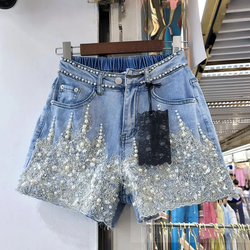 

Женские короткие джинсы с блестками и бусинами, летние эластичные трапециевидные джинсовые шорты в Корейском стиле с высокой талией и широ...