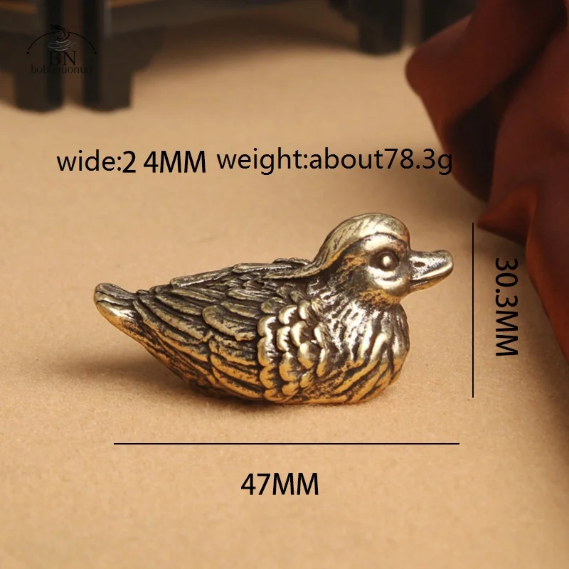 

Медные фигурки уток-мандаринок