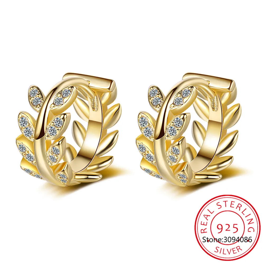 

Женские серьги-кольца с серебряными листьями