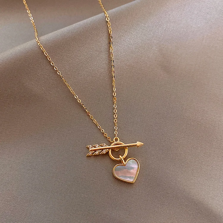

Ожерелье с кулоном в виде сердца со стрелкой для женщин и девушек модное ожерелье до ключиц в форме сердца из ракушки подарок на свадьбу или ...