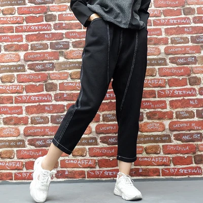 

Europe and the United States large casual irregular nine-point trousers early autumn new elastic waist jeans women