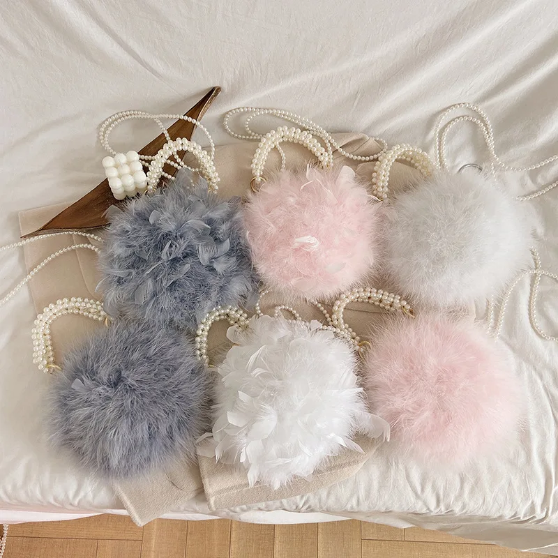 

2021 Autumn and Winter New Ostrich Feather Fur Handbag for Women Turkey Plush Pearl Portable Diagonal Female Small Round Flaps