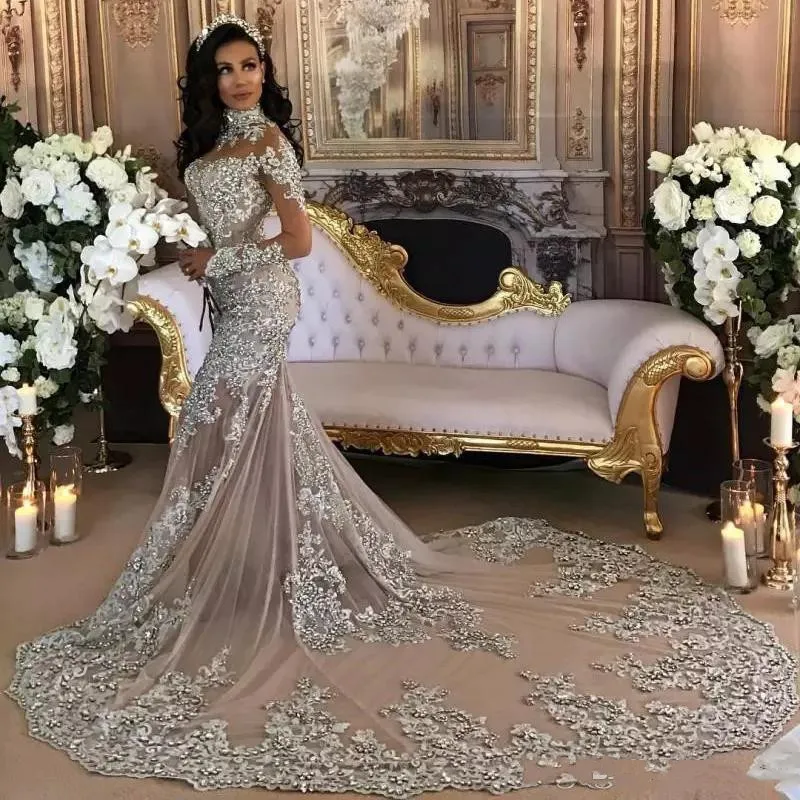 

Dubai Arabic Luxury Sparkly 2021 Wedding Dresses Sexy Bling Beaded Lace Applique High Neck Illusion Long Sleeves Mermaid Chapel