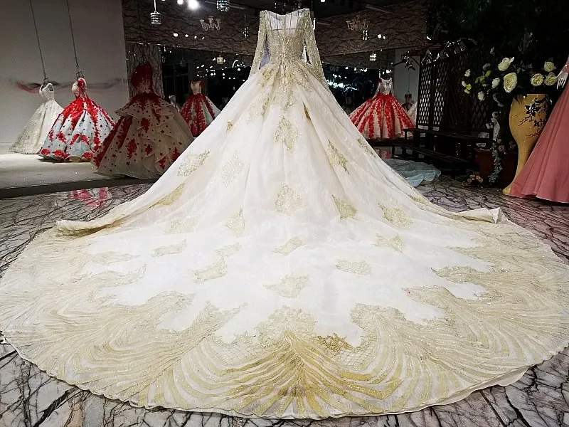 Свадебное платье цвета шампанского и золотого с длинным рукавом настоящие