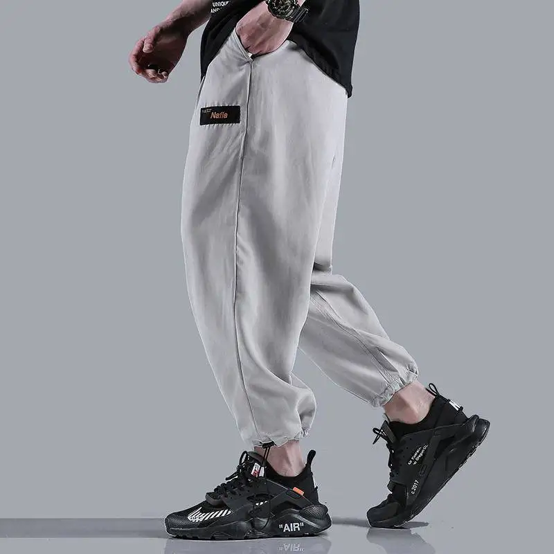 

pure color easy leisure trousers male students draw string beam foot ins than nine points pants men's movement to the fire