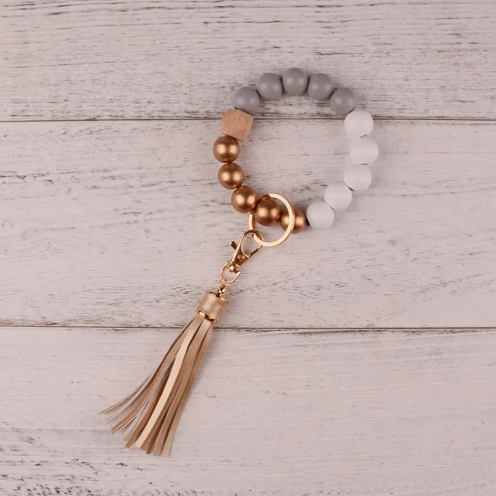 

Keychain For Keys Leather Tassel Wood Beads Bracelet Keyring For Women Accessories Multicolor Keychain Wholesale Hot Sale 2021
