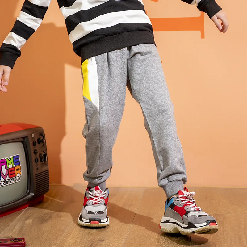 

Детские спортивные брюки с боковыми вставками, свободные весенне-осенние тонкие брюки для мальчиков и девочек, детская хлопковая спортивна...