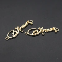 professional custom oval engraved brand logo metal labels for swimwear small metal letter logo label sew for bag
