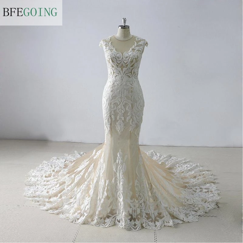 

Ivory Lace Appliques Champagne Tulle Sleeveless Floor-Length Mermaid/Trumpet Wedding Gowns Chapel Train Custom Made