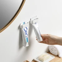 wall mounted toothpaste clip hanging toilet storage facial cleanser home storage household toothpaste squeezing device rack