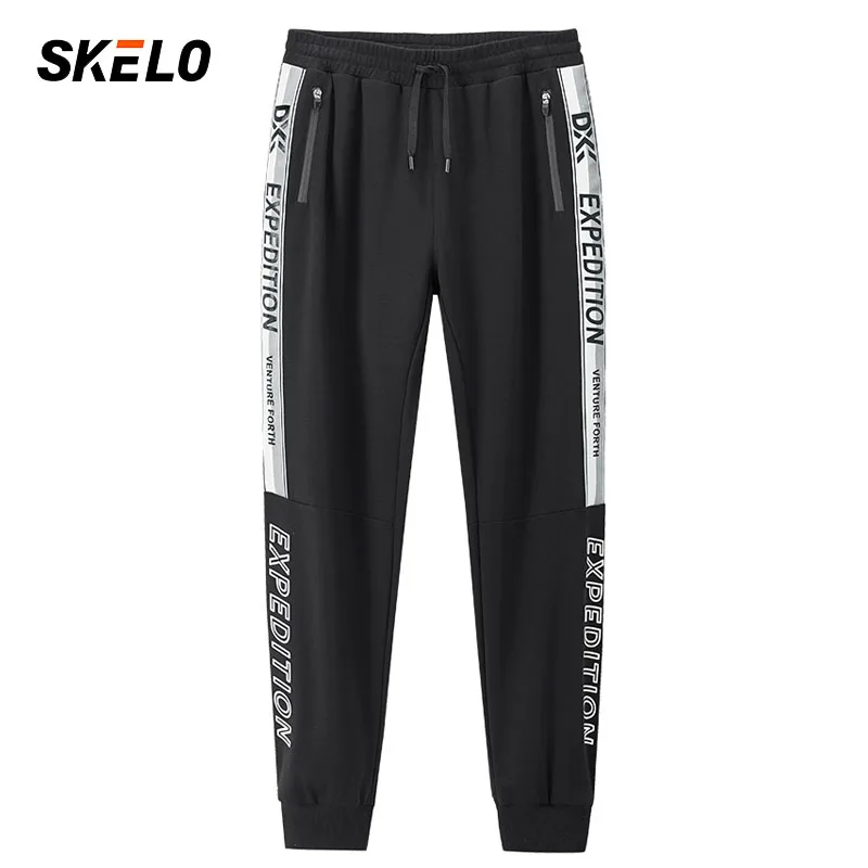 Леггинсы мужские спортивные с карманами эластичные свободные для бега 2021