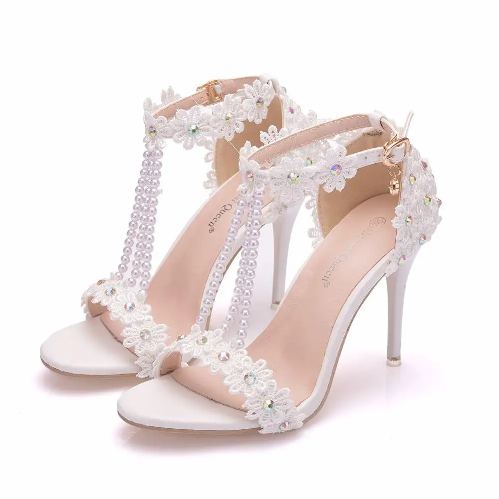 

Crystal Queen Women Sandals White Lace Flowers Pearl Tassel Bridal 9cm Heel Fine High Heels Slender Bridal Pumps Wedding Shoes