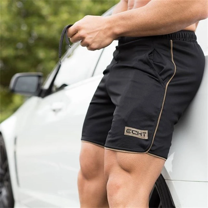 

Summer mens gym fitness shorts Bodybuilding jogging workout male Slim fit short pants Knee Length Breathable Mesh Sweatpants