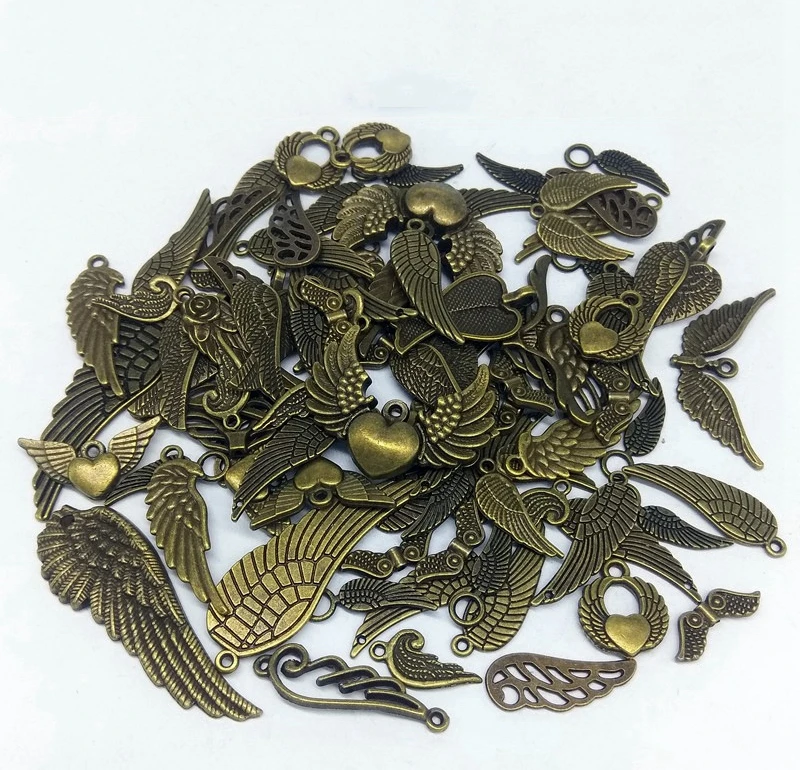 100 граммов в упаковке смешанпосылка из сплава виде крыльев и перьев для легких