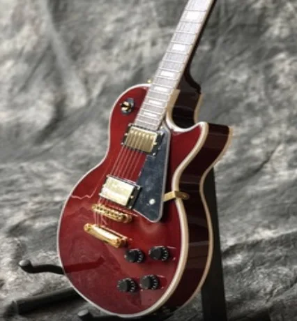 

Custom guitar,red color,with 3 pickups.Gold color hardware.Rosewood fingerboard .mahogany body