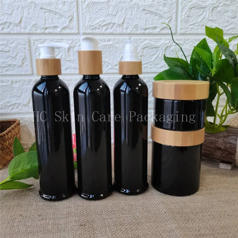 

Wholesale 250ml 100pcs clear black plastic shampoo lotion bottles and 250g skin care cream jars with bamboo lid 8oz containers