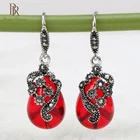 Женские серьги из серебра 925 пробы с красными и зелеными камнями