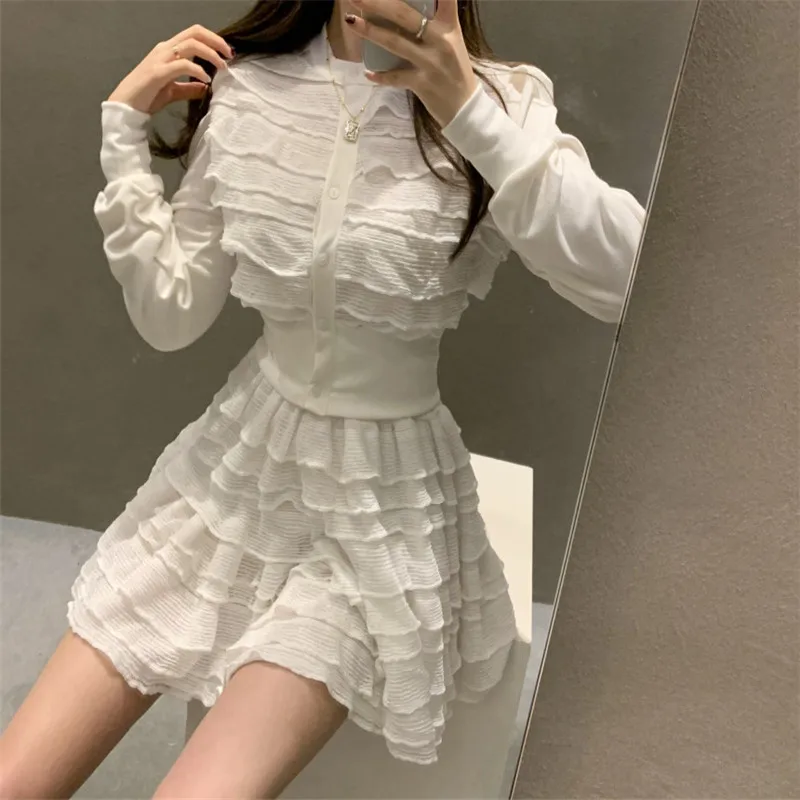 

RUGOD 2021 spring round neck solid color commuter layered ruffled cake skirt suit