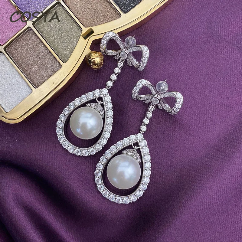 

COSYA Real 925 Sterling Silver High Carbon Diamond Bow Luxury Pearl Drop Earrings Water Drop Hollow Out Design Jewelry Wholesale