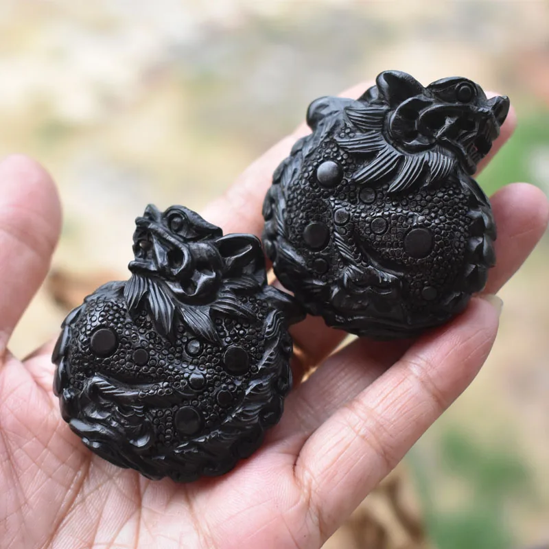 

Natural black sandalwood, engraving rounded dragon mythical wild animal, pendant ornament