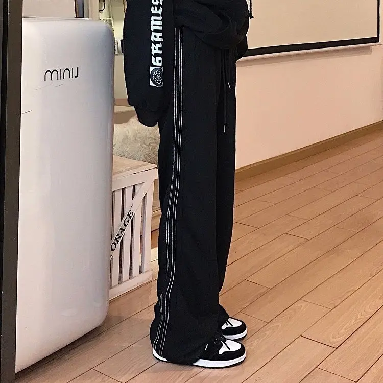 

2021 black sports pants trend Korean style retro dotted striped sports pants Joker casual pants pants for men and women