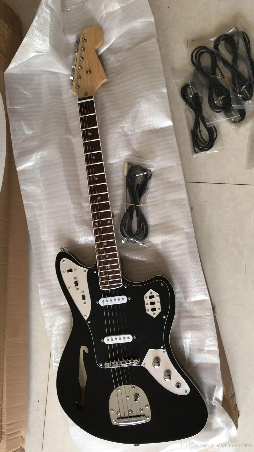 

Black Jaguar Electric Guitar Tremolo Bridge, Single F Hole, Maple Neck & Fingerboard, Dot Inlay, Black Pickguard, Vintage Tuner