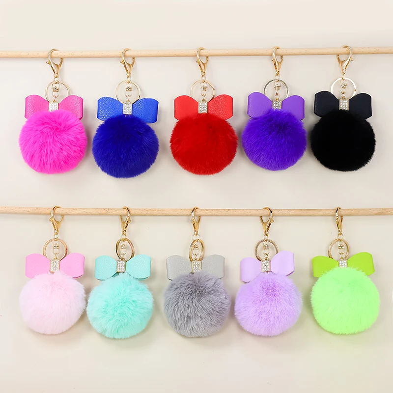 

Pompom cute children's gift keychain pendant Rhinestone inlaid PU bowknot hairball keychain Ladies bag keychain accessories