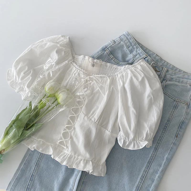 

Французская Милая рубашка с перекрестными шнуровками, белая рубашка с пышными рукавами, Женский дизайнерский нишевый топ с деревянными ушк...